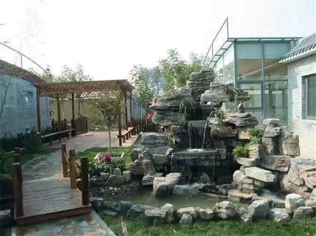 西乌珠穆沁别墅庭院鱼池假山景观